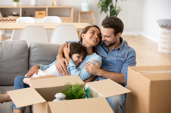 happy family moving in to their new home